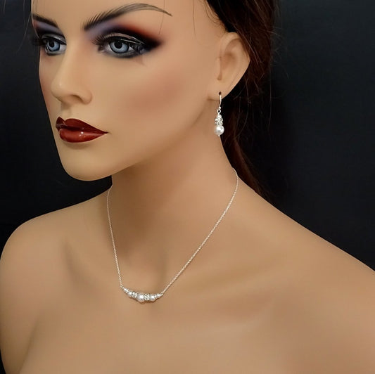 pearl and crystal necklace and earrings set on a model mannequin