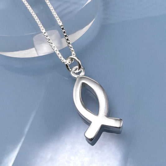 A silver fish pendant necklace with a chain and a small clasp.