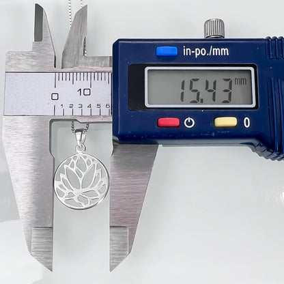 A silver pendant necklace is being measured with a caliper, which displays the size of the necklace in millimeters.