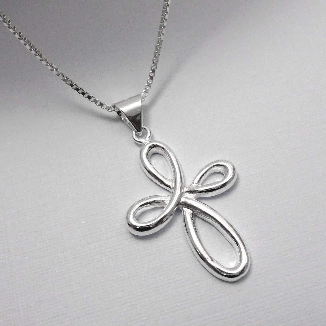 A silver cross pendant necklace with a unique twisted design.