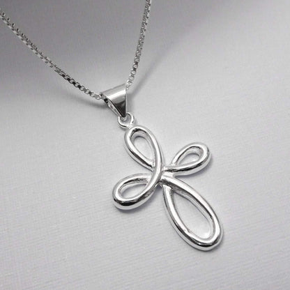 A silver cross pendant necklace with a unique twisted design.