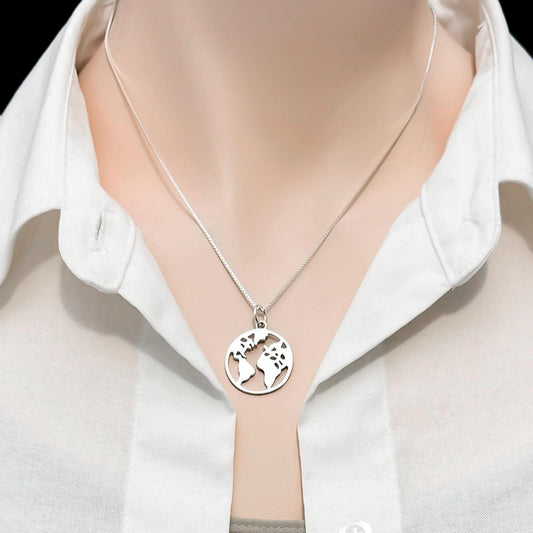 A silver necklace with a circular pendant featuring a world map design.