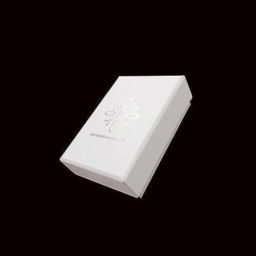 A white box with a silver flower design on it, set against a black background.