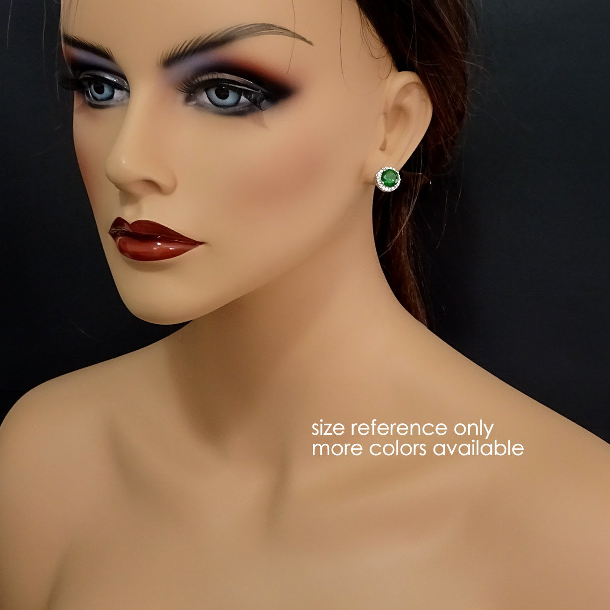 round dark green cubic zirconia crystal stud earrings on a model mannequin