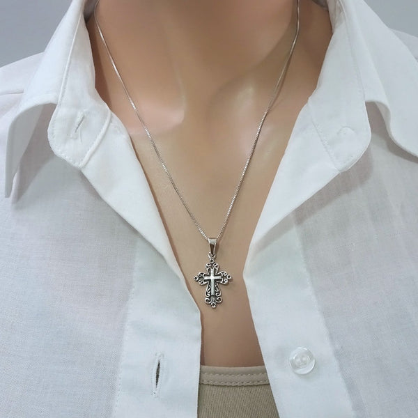 oxidized cross necklace on a model mannequin