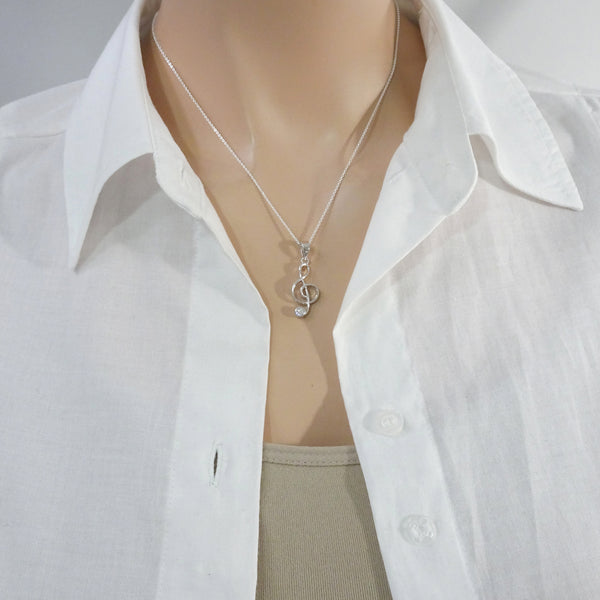treble clef necklace on a model mannequin