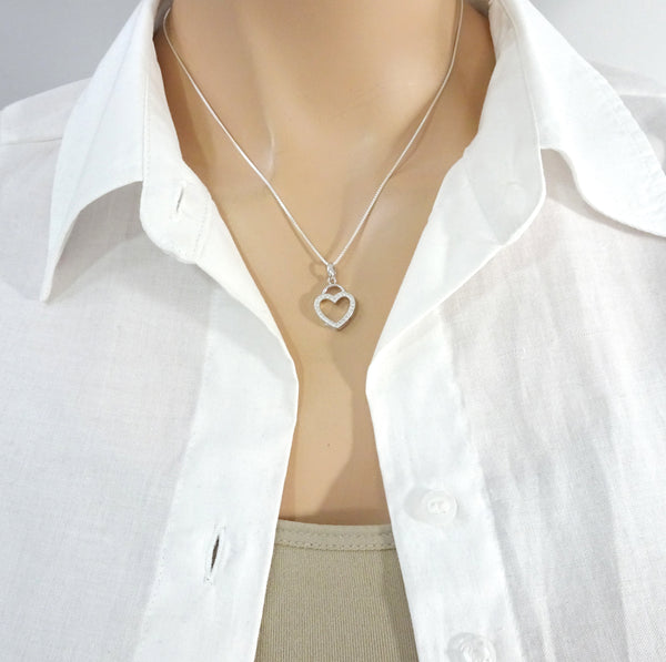 open heart necklace with cz stones on a model mannequin