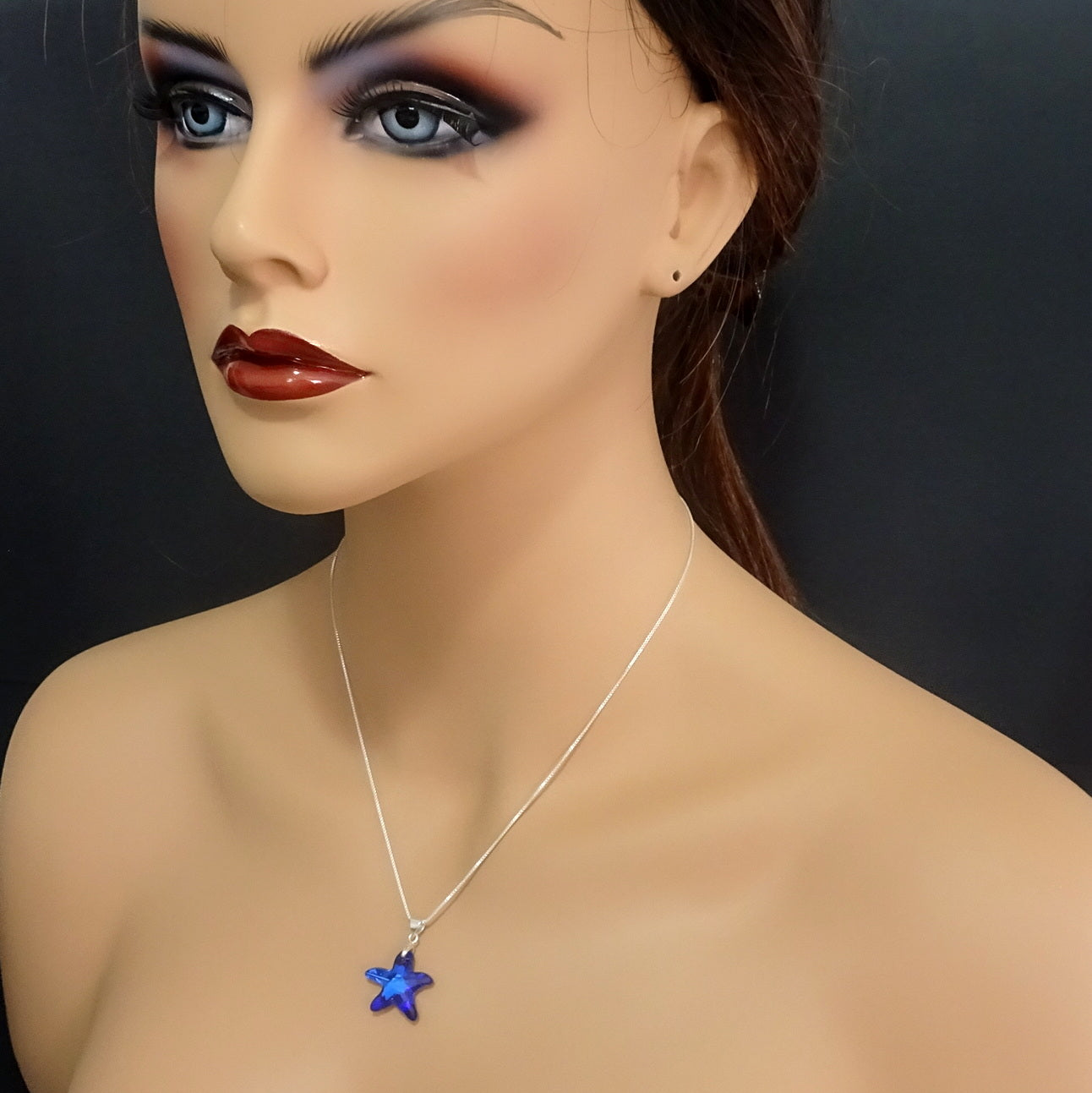 bermuda blue crystal starfish necklace on a model mannequin