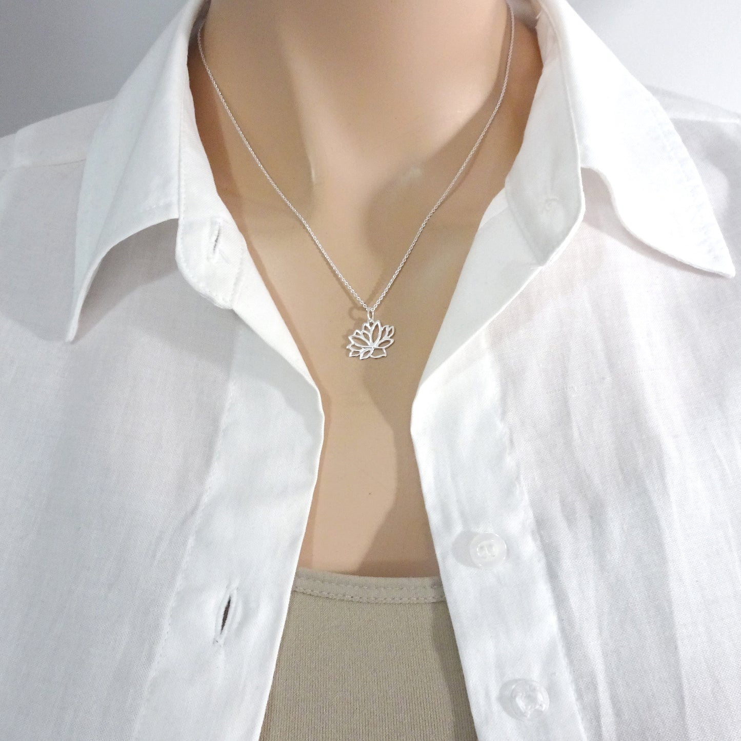 lotus flower necklace on a model mannequin