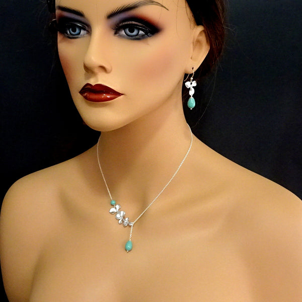 orchid and jade pearl necklace and earrings set on a model mannequin