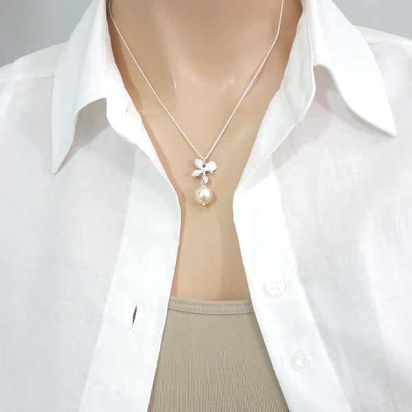 ivory pearl and orchid necklace on a model mannequin