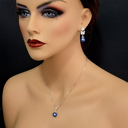 cubic zirconia iridescent blue pearl necklace and earrings on a model