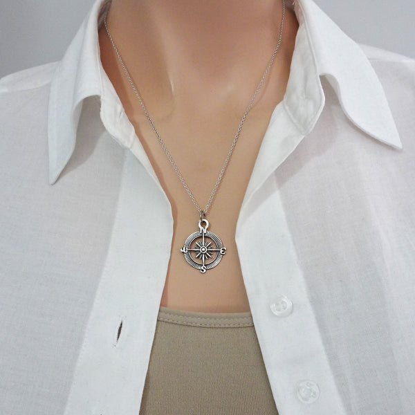 compass necklace on a model mannequin