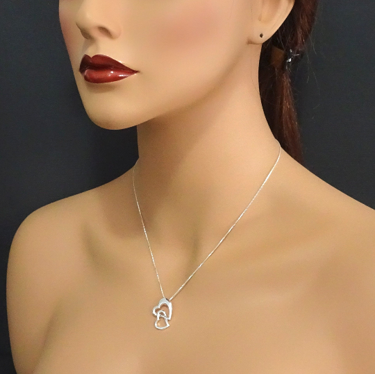 mother and daughter heart necklace on a model mannequin