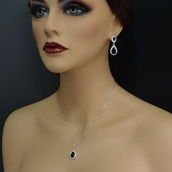 dark blue cubic zirconia drop crystal necklace and earrings set on a model mannequin