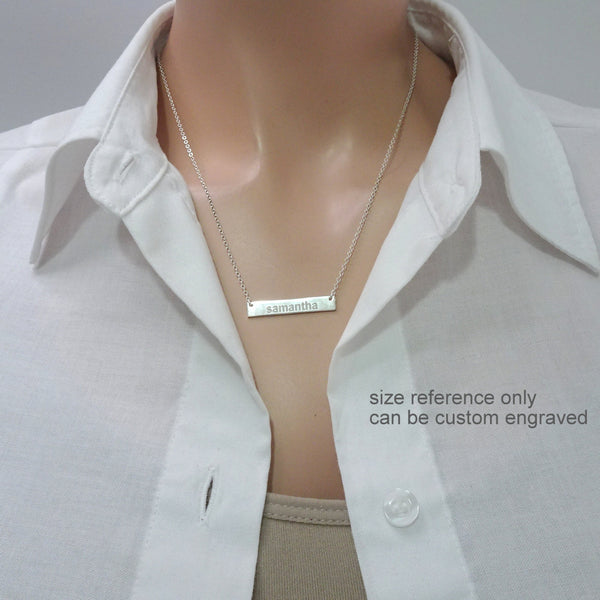 customizable engraved bar necklace on a model mannequin