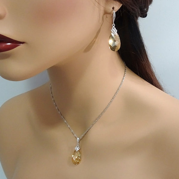 golden shadow crystal necklace and earrings set on a model mannequin