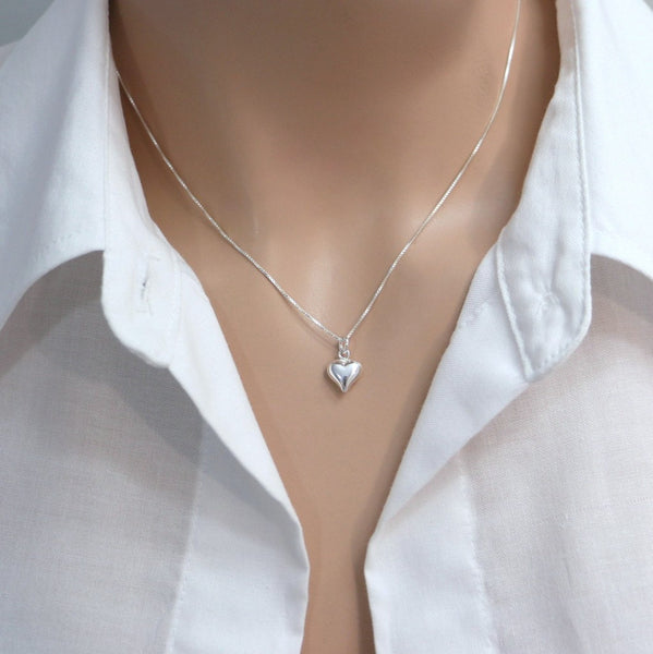 tiny heart necklace on a model mannequin