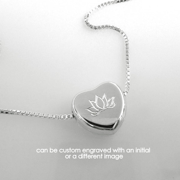 heart necklace engraved with lotus flower
