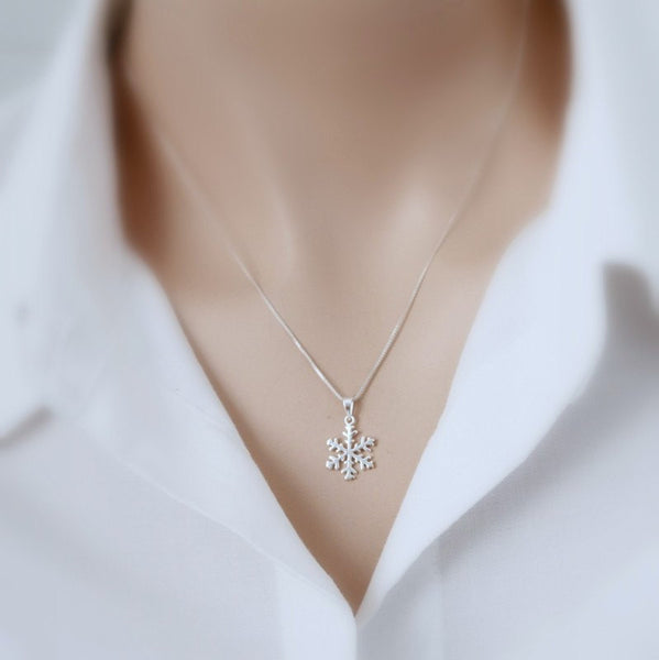 snowflake necklace on a model mannequin