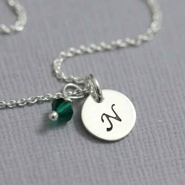 stamped disc with emerald green crystal necklace