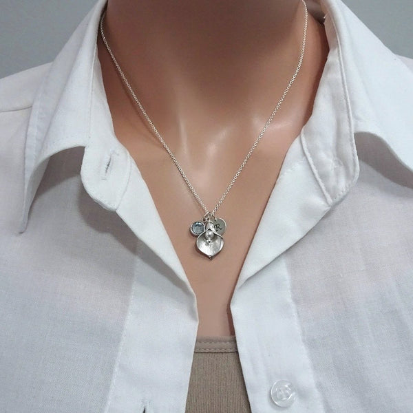 calla lily and white pearl necklace on a model mannequin