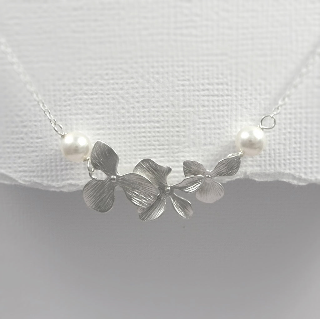 orchid and white pearl necklace