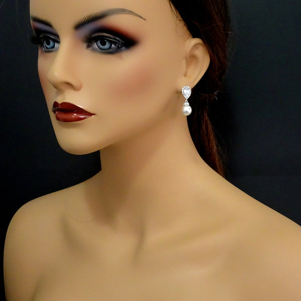 ivory pearl and cubic zirconia earrings on a model mannequin