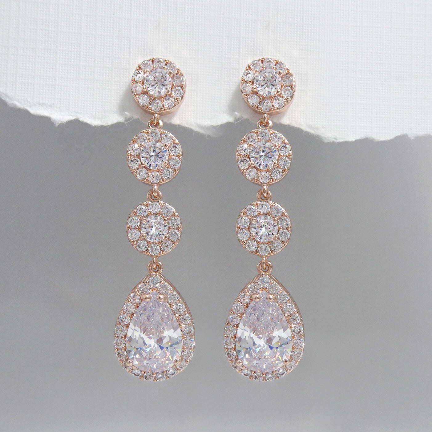 cubic zirconia pear crystal long dangle earrings in rose gold plated finish