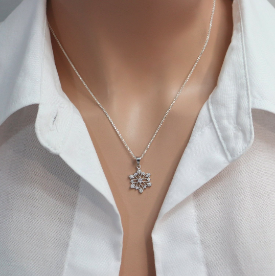cubic zirconia snowflake necklace on a model mannequin