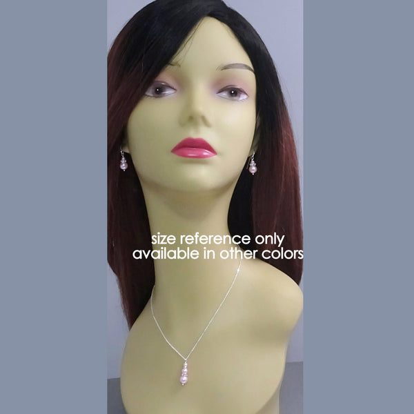 pearl necklace and earrings on a model mannequin