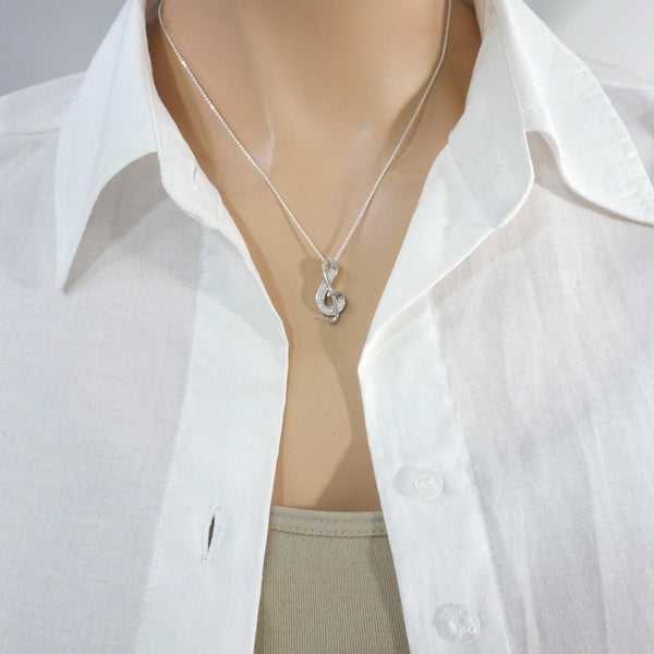 cz music note necklace on a model mannequin